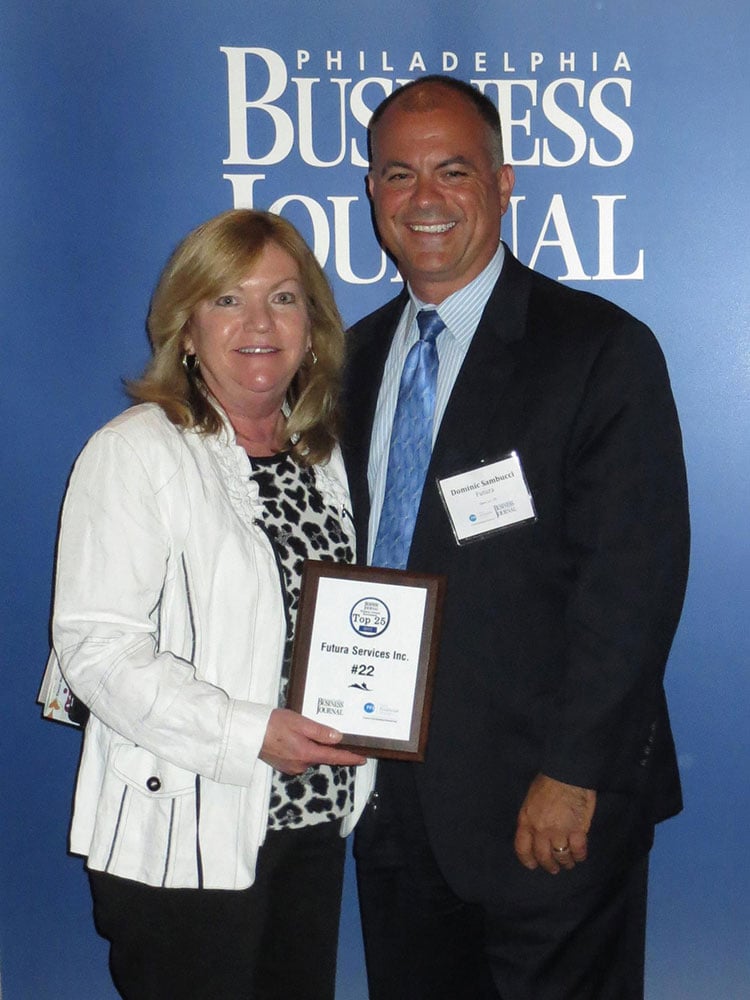 Janet posing with her award